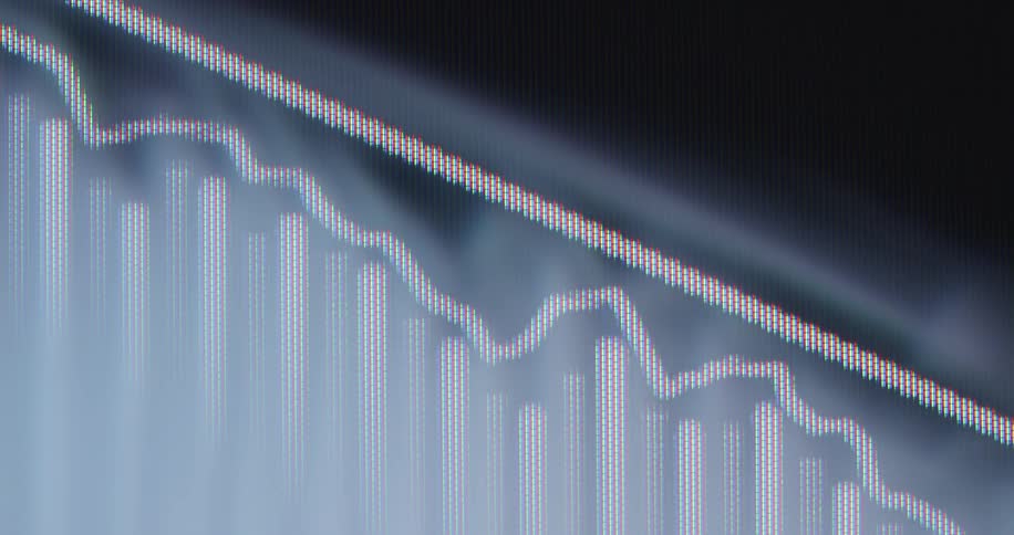 Extreme close-up of a declining financial chart on a digital screen with a downward-pointing arrow indicating a market recession