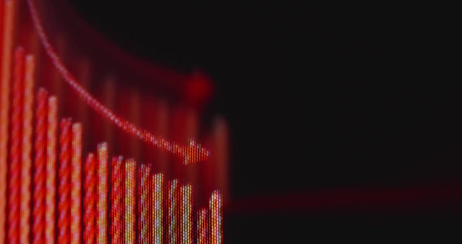Extreme close-up of a digital screen showing a red bar graph and arrow trending downwards, illustrating a financial crisis or market crash