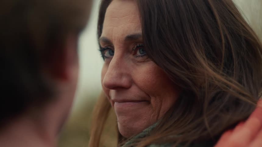 Cinemagraph of an affectionate woman with blue eyes smiling lovingly at her partner