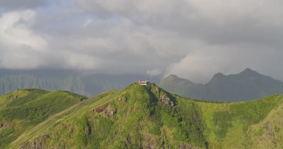 An epic aerial view slowly reveals the historic Lanikai Pillboxes along the scenic Kaiwa Ridge Trail on the island of Oahu, Hawaii