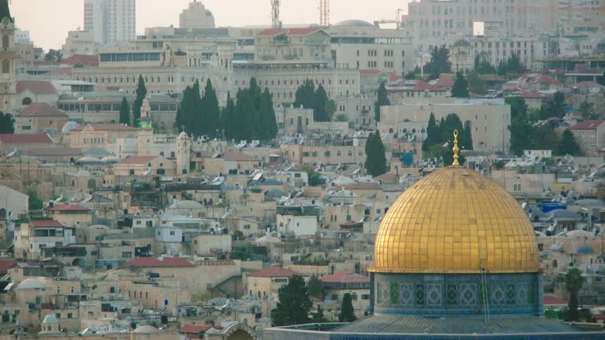 A tilt-down shot reveals the golden Dome of the Rock overlooking the ancient cityscape of Jerusalem
