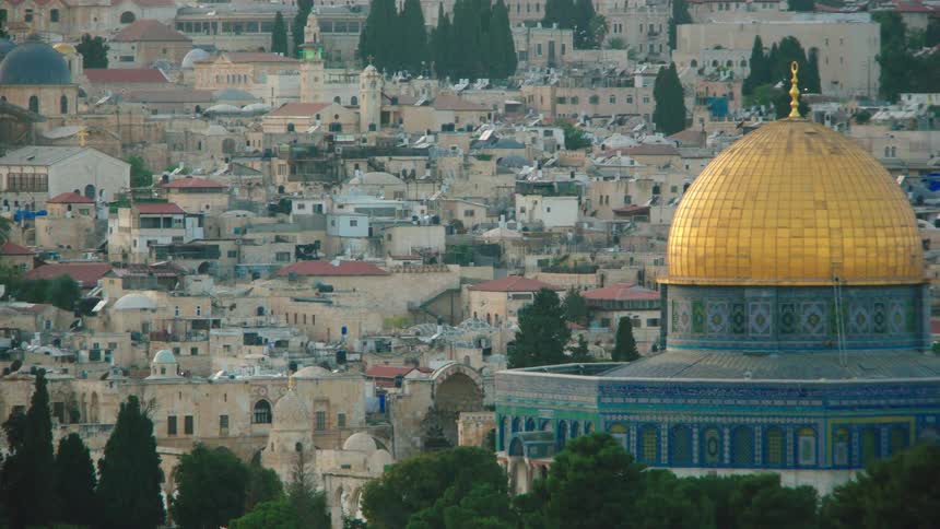 A panning shot reveals the iconic golden Dome of the Rock against the ancient cityscape of Old Jerusalem