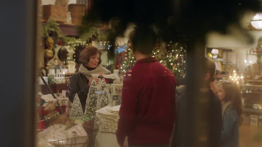 People browse in a shop at night