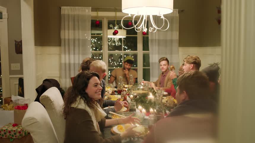 A group of people gathered around a table eating