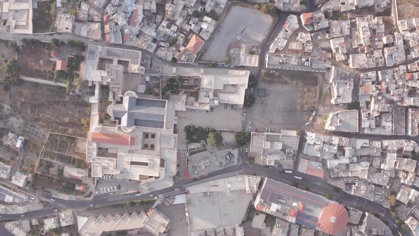 A static top-down aerial view of the Basilica of the Annunciation and the surrounding city of Nazareth, Israel