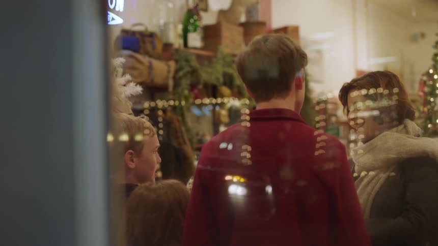 A family shops in a store at christmas time
