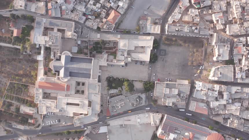 A static aerial top-down view of the Basilica of the Annunciation in the heart of the city of Nazareth, Israel