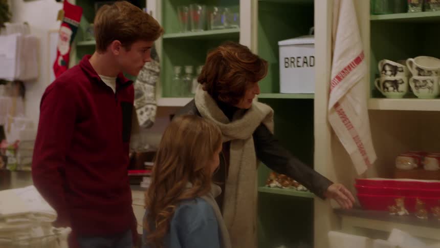 A family walks through a shop together