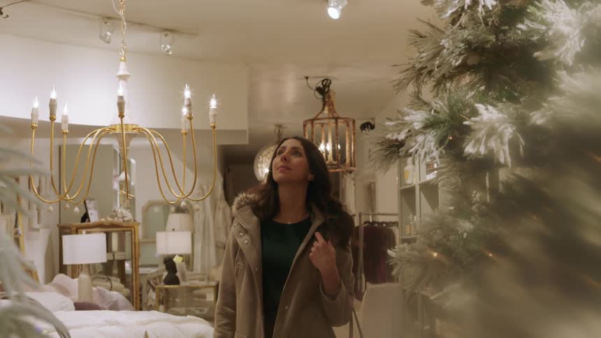 A woman looks around a home goods store
