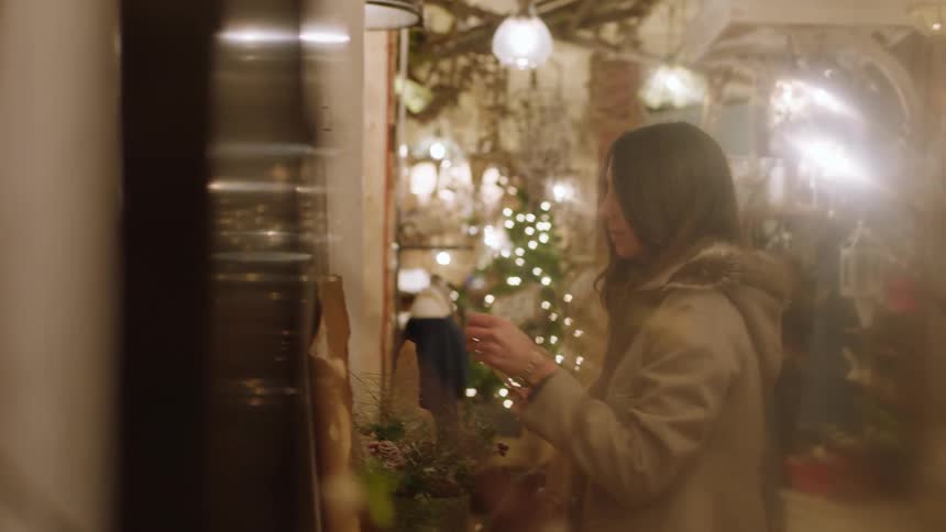 Woman examines a tag in a store