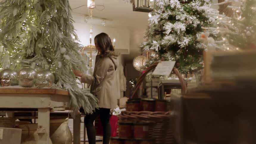 A woman holding multiple bags shops