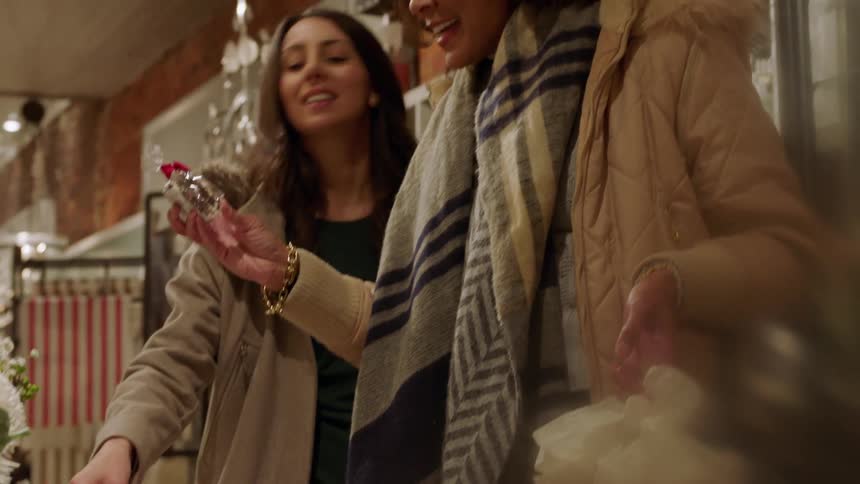 Two women looking at gifts in gift shop