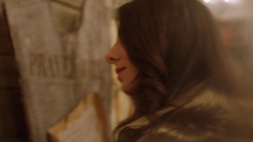 A woman looks at tags on a wall