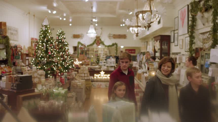Woman and children walking and looking around in gift shop