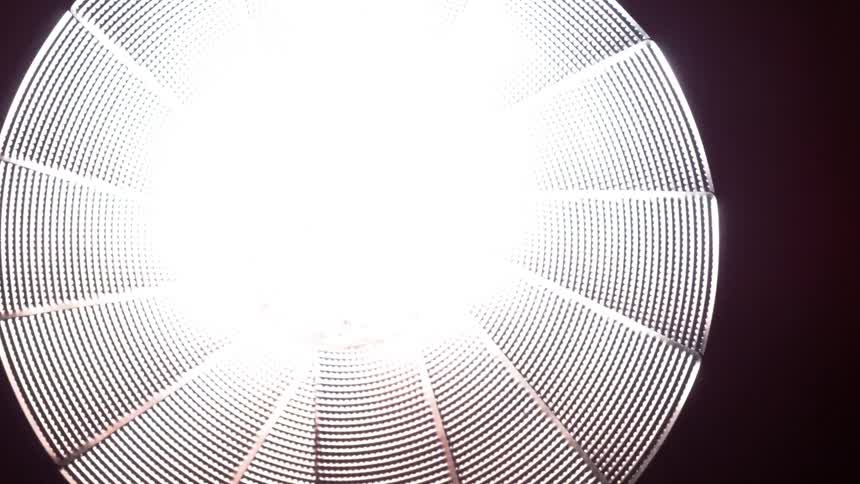 Overhead light shining brightly and then burning out