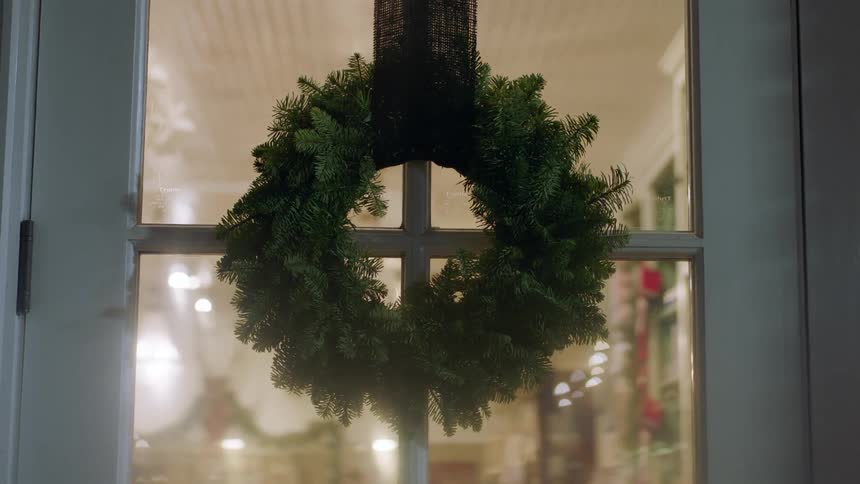 Wreath hung on the front door of a shop
