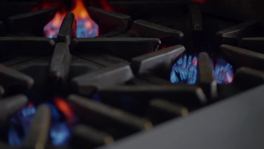 Burner flames lighting up on stove top