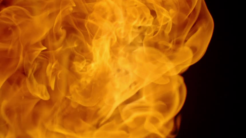 A flame billows and burns