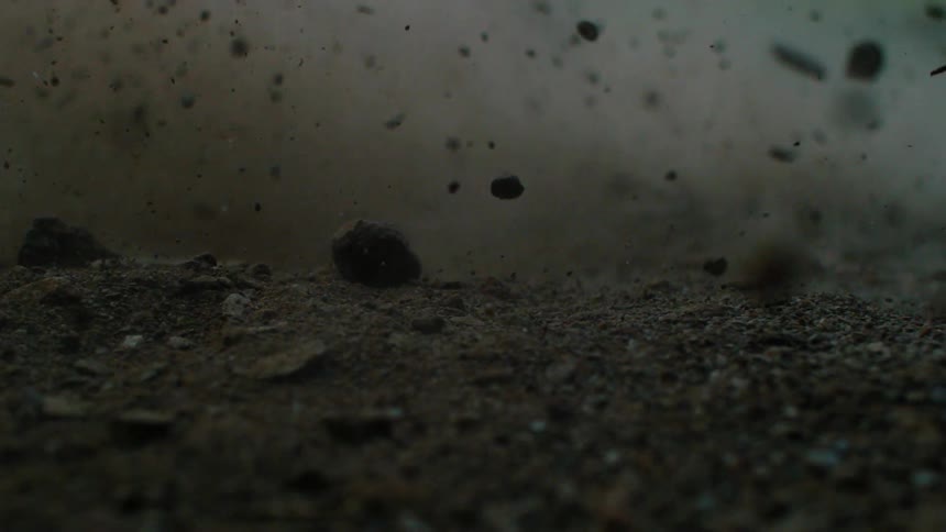 Dirt and rocks falling to the ground
