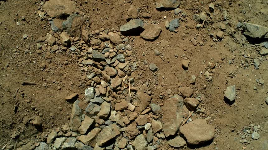 The rocks and soil on the ground shake from tremors