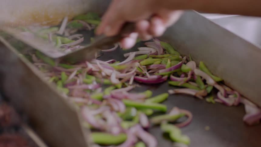 Vegetables are cooked in a restaurant kitchen