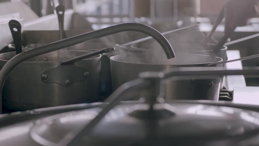 Pots boil over in a kitchen