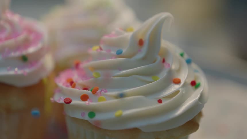 A close up view of a cupcake and its frosting