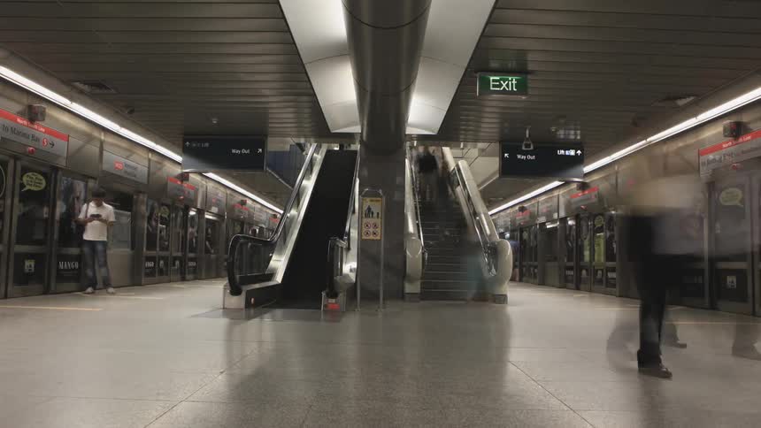 Pedestrians walking through a subway station