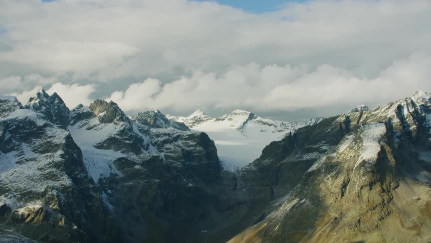 Helicopter Timelapse - View of mountains on a cloudy day