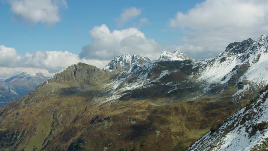 Moving past mountains with ice on top