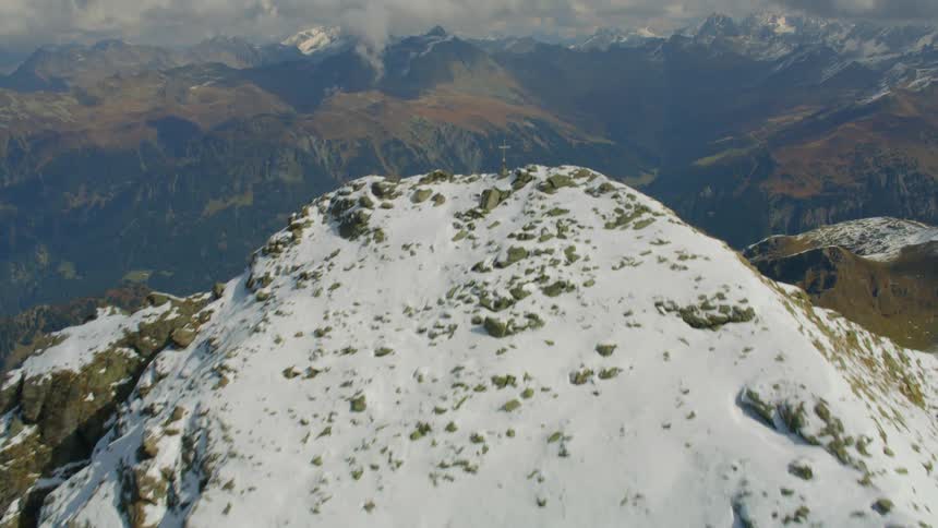 The mountains covered with snow lead to a valley