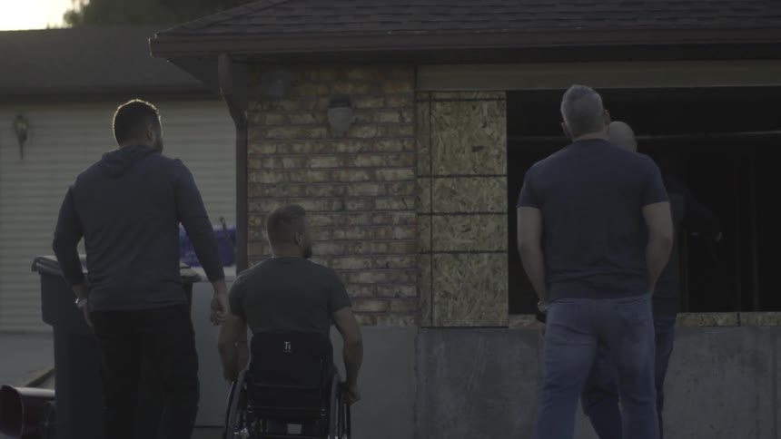 People walk over to a house