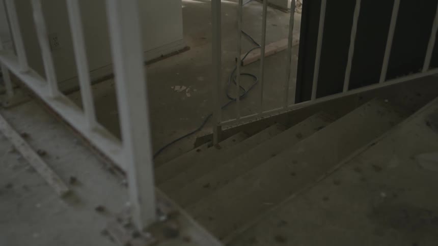 Stairway leading to another floor of a home undergoing renovation