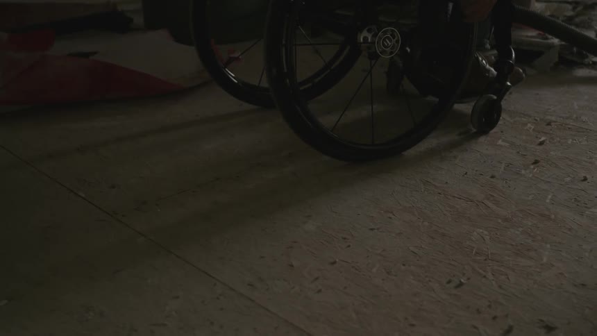 View of wheelchair wheels and feet