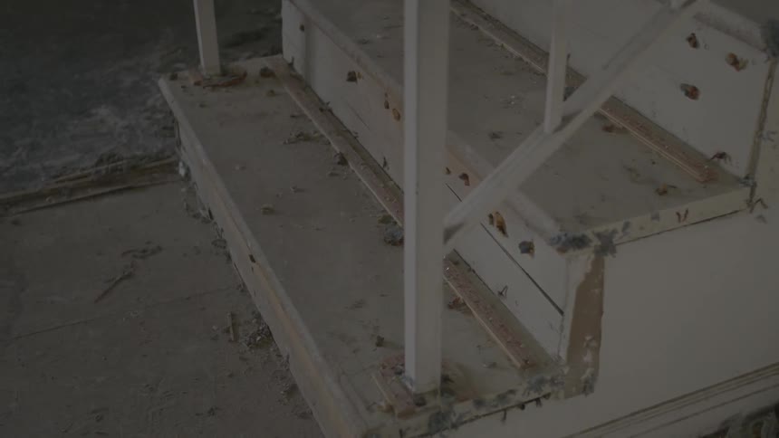 Paint ships and dirt lie on a set of stairs