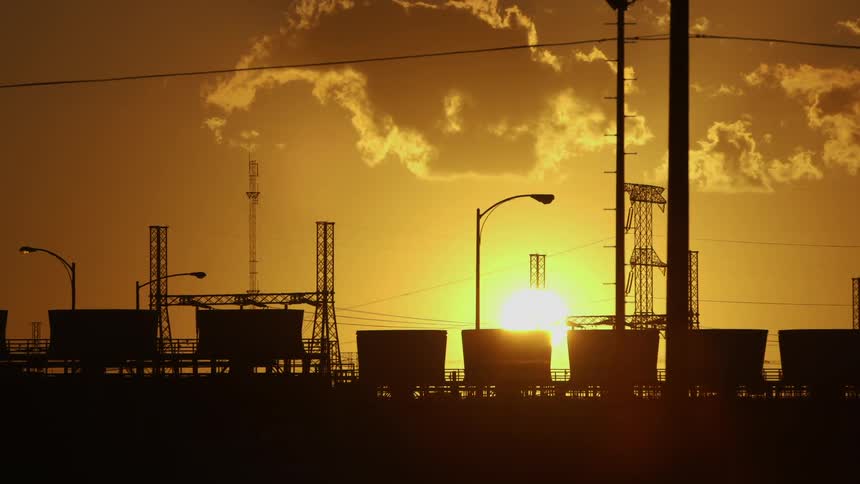 Sun setting over an industrial park