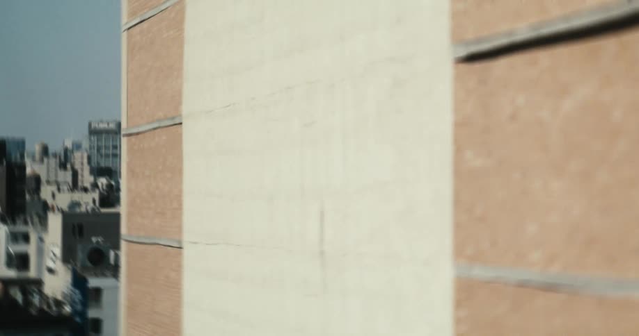 A cinematic tracking shot reveals the iconic New York City skyline with diverse architecture in the foreground