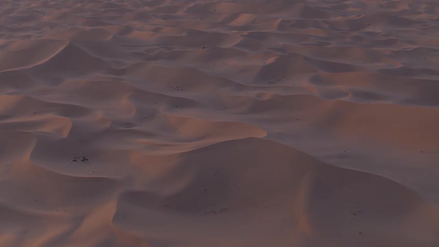 The sand dunes cover a large area below