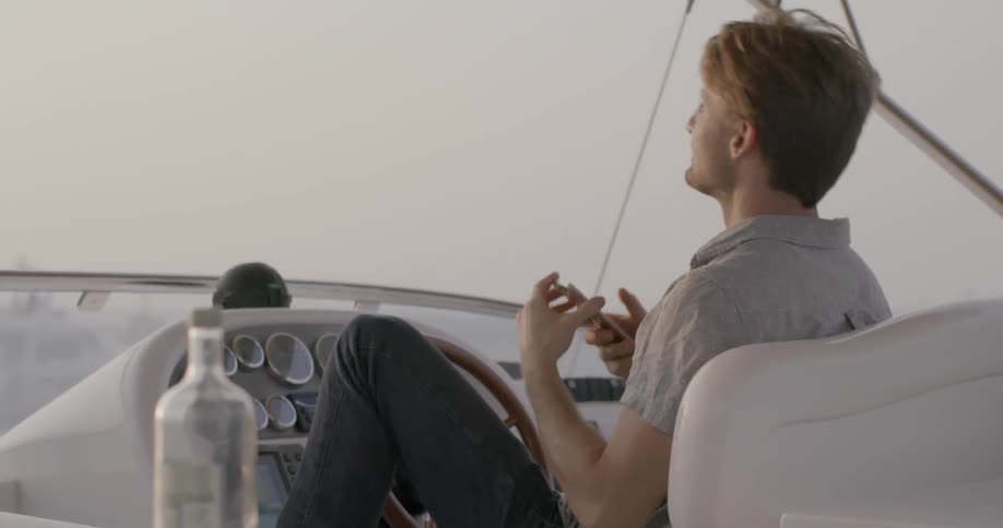 Man sitting in a boat taking pictures