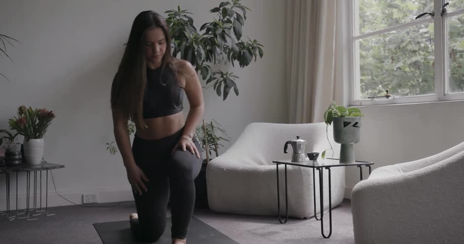 A woman slowly gets up and walks away