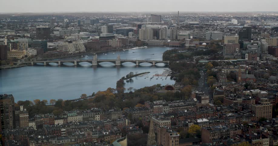 A dynamic time-lapse of the Boston cityscape as clouds cast moving shadows over the Charles River, Beacon Hill, and the Longfellow Bridge