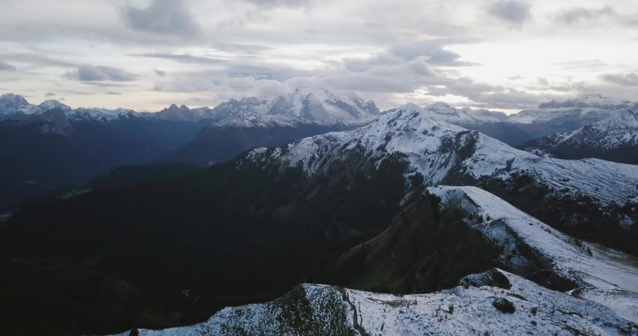 View of snowy mountains on a cloudy day