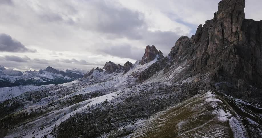 Snow dusts the slopes of a mountain range