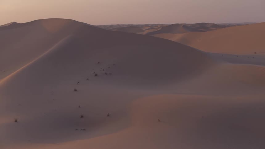 The sand dunes move on at dawn