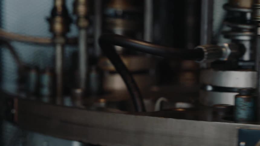 A close-up view reveals the intricate inner workings of a spinning industrial machine