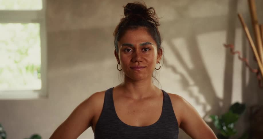 Cinemagraph portrait of a serene woman in athletic wear looking directly into the camera