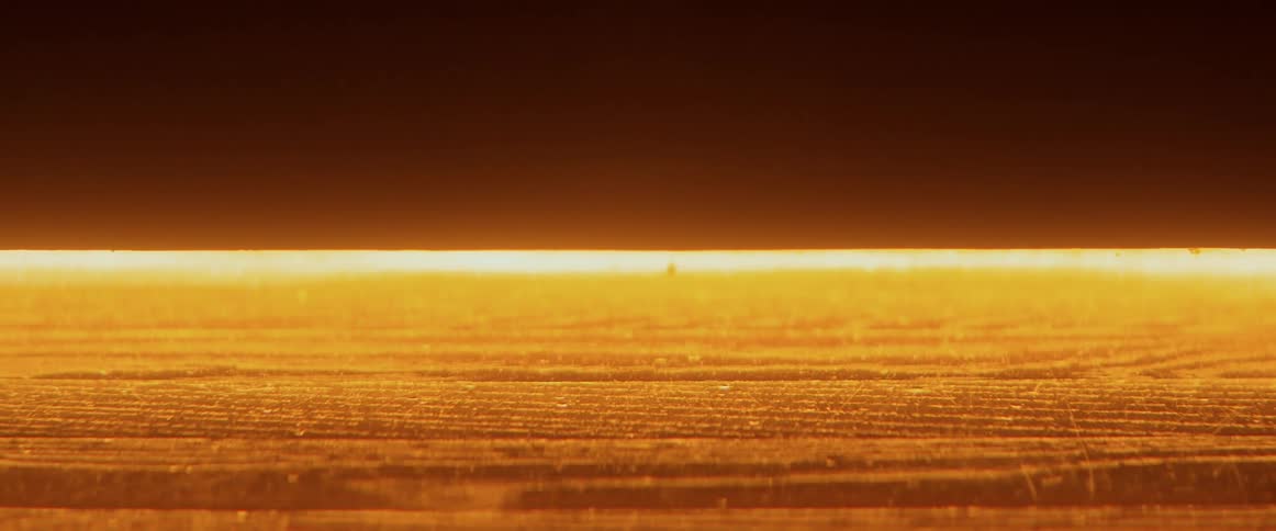 The POV of a door lit in an orange glow