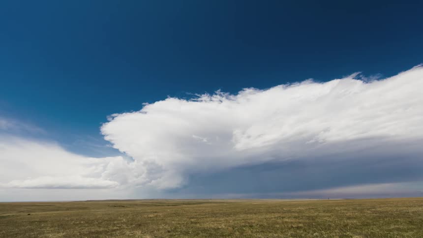 Time-lapse of clouds moving over flat lands