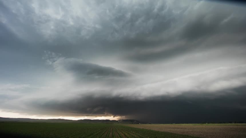 Time lapse of clouds rolling over plans in the evening