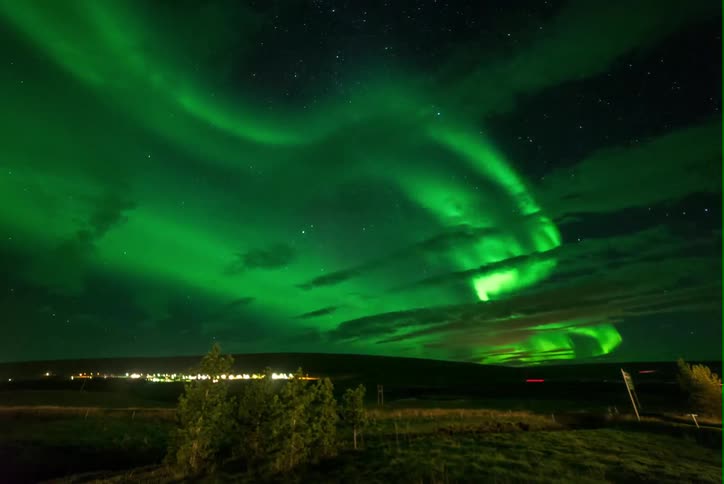 The aurora borealis lights up the sky